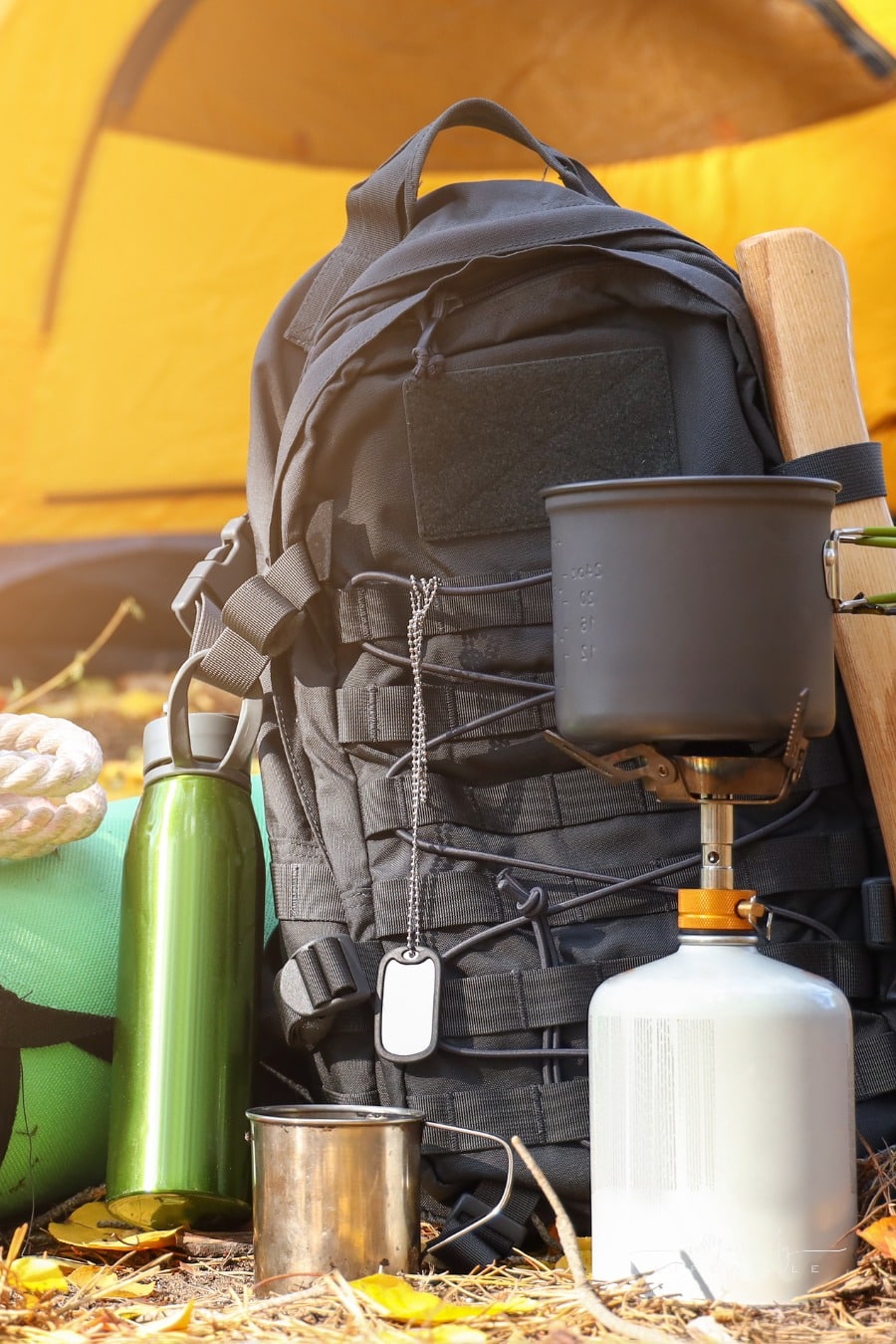 camping gear on ground in front of tent