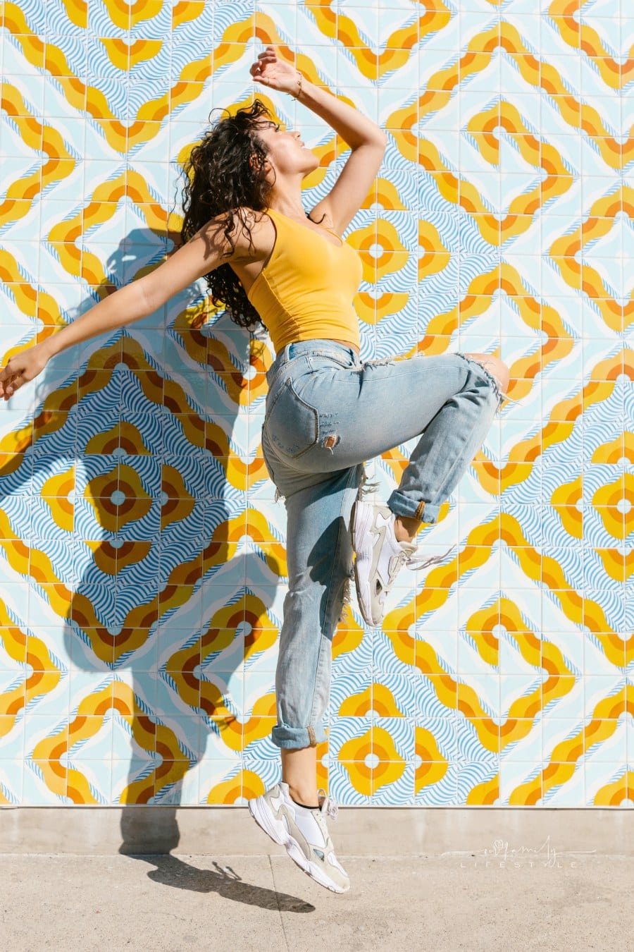A Woman in Yellow Tank Top Dancing on the Street