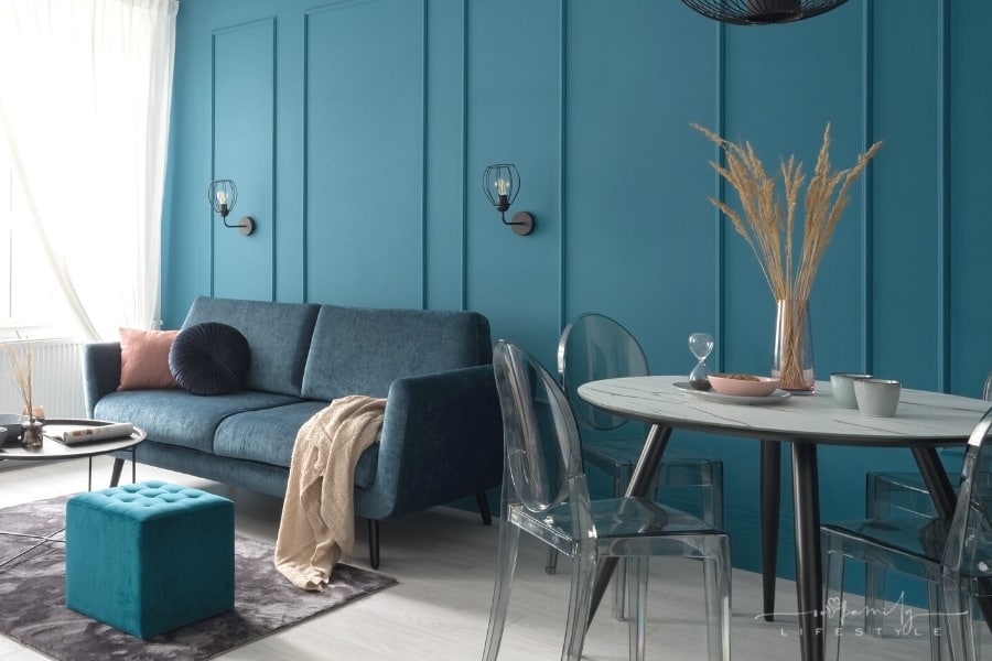 teal blue accent wall in living and dining room