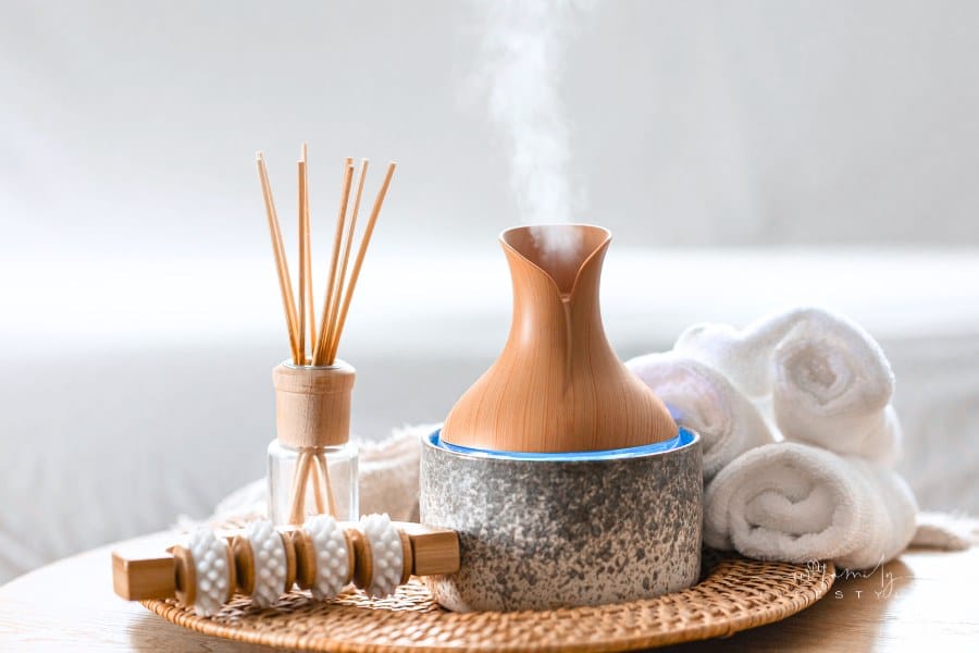 Essential oil aroma diffuser humidifier diffusing water particles in the air.