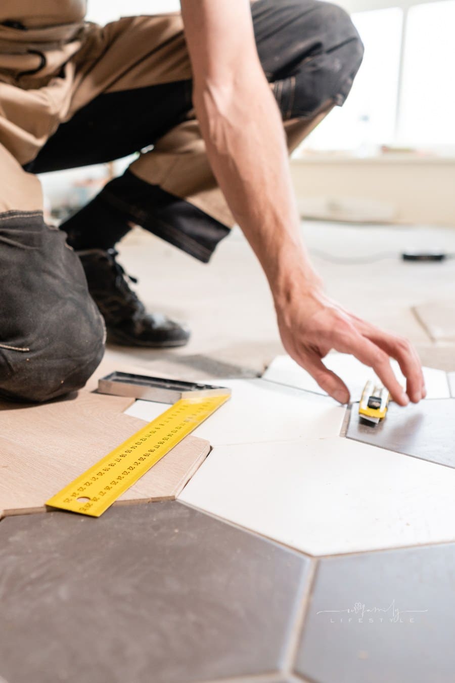 The combination of wood panels of laminate and ceramic tiles in the form of honeycomb. Kitchen renovation.
