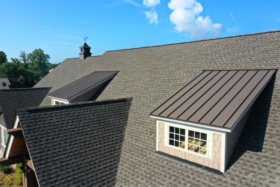 modern house with metal and asphalt shingle roof