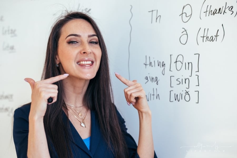 ESL teacher shows how to pronounce sounds