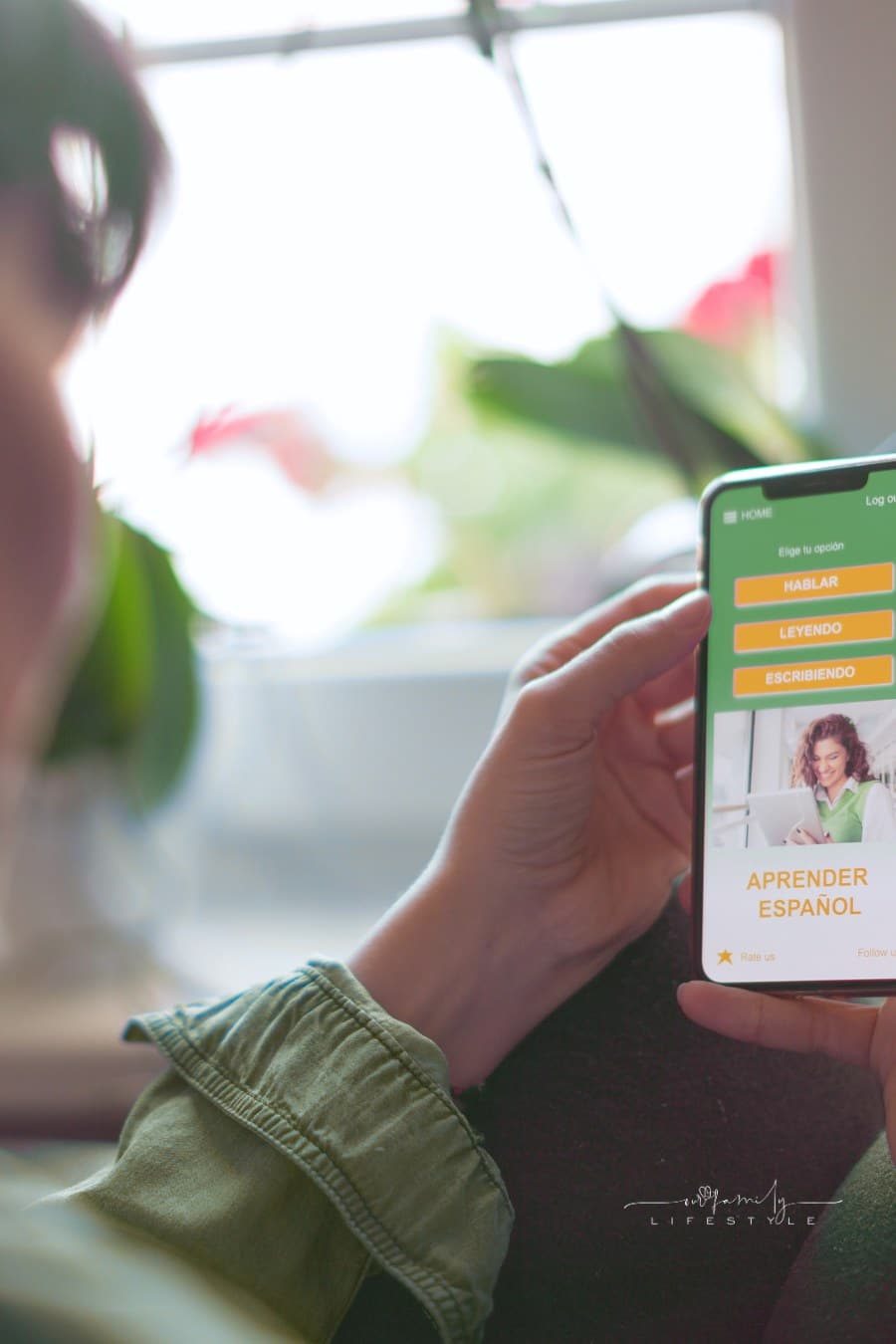 Woman learning Spanish using a mobile app