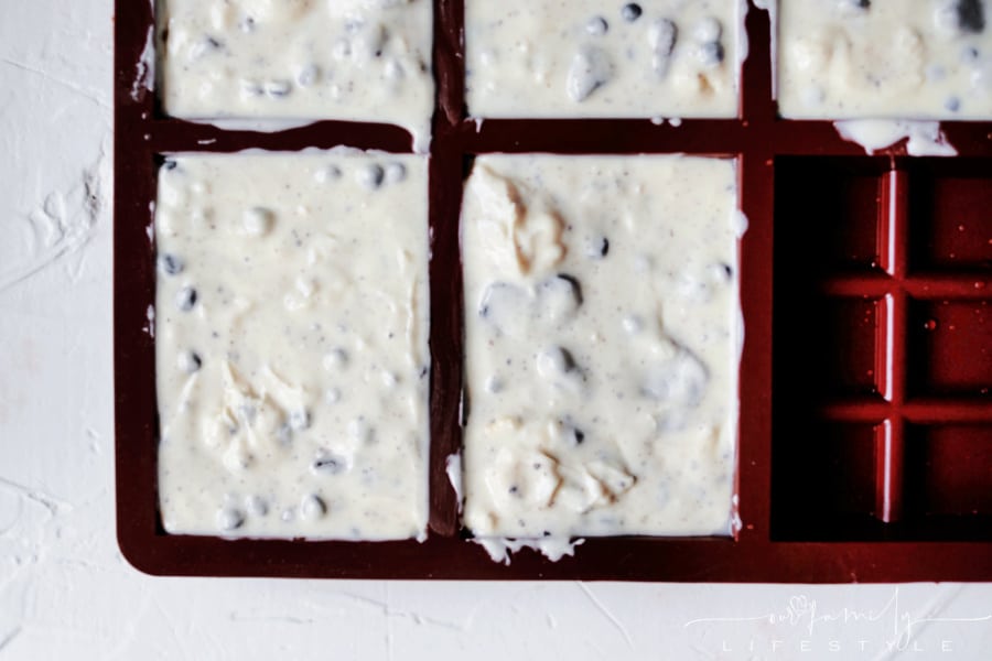 melted white chocolate and Oreos in rubber mold