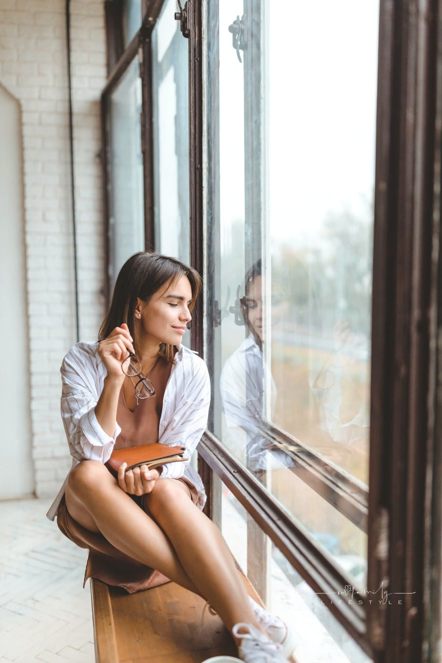 Woman Looking Out The Window