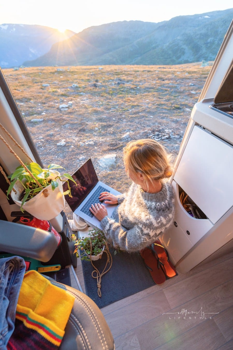 Woman working remotely, van life concept