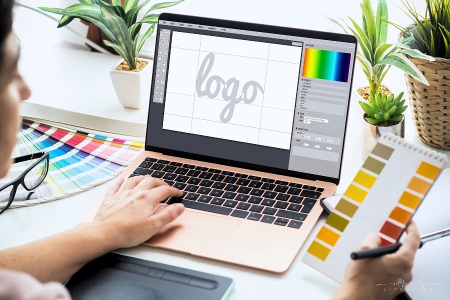 graphic designer working on a logo on a laptop