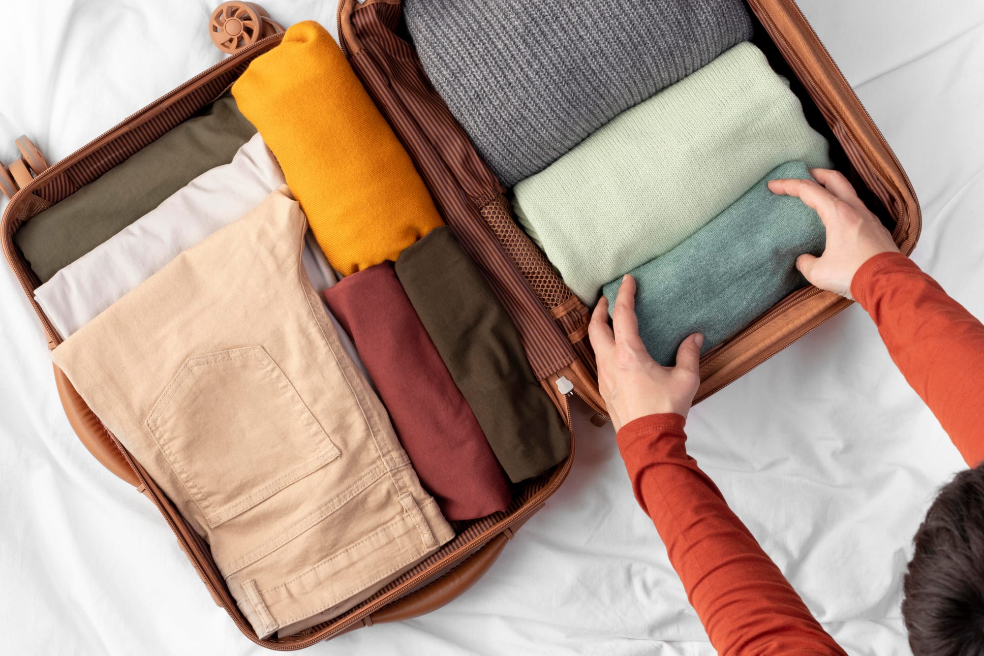 Roll, don’t fold when packing. Rolling saves space and reduces wrinkles.