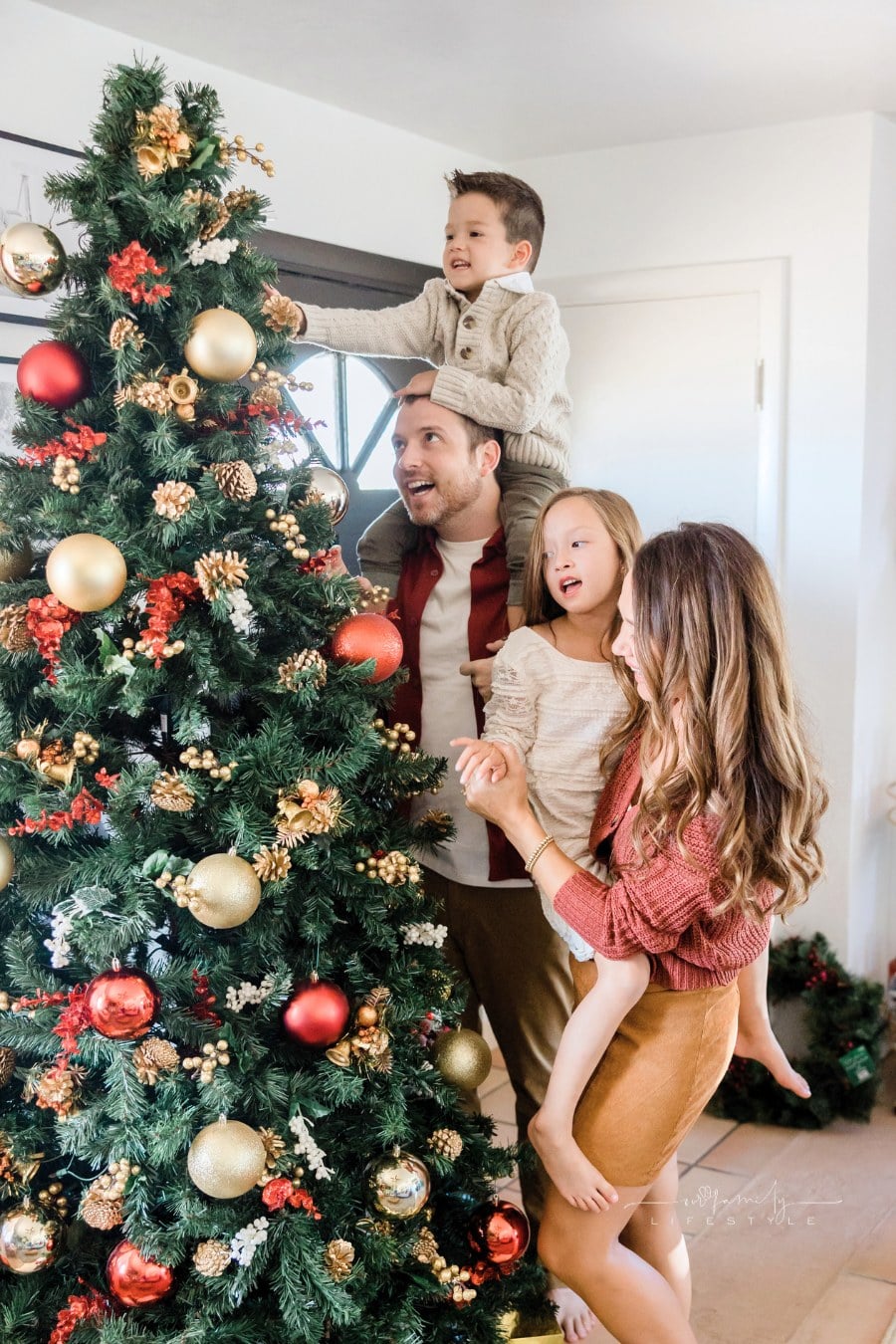 Family Decorating Christmas Tree Together