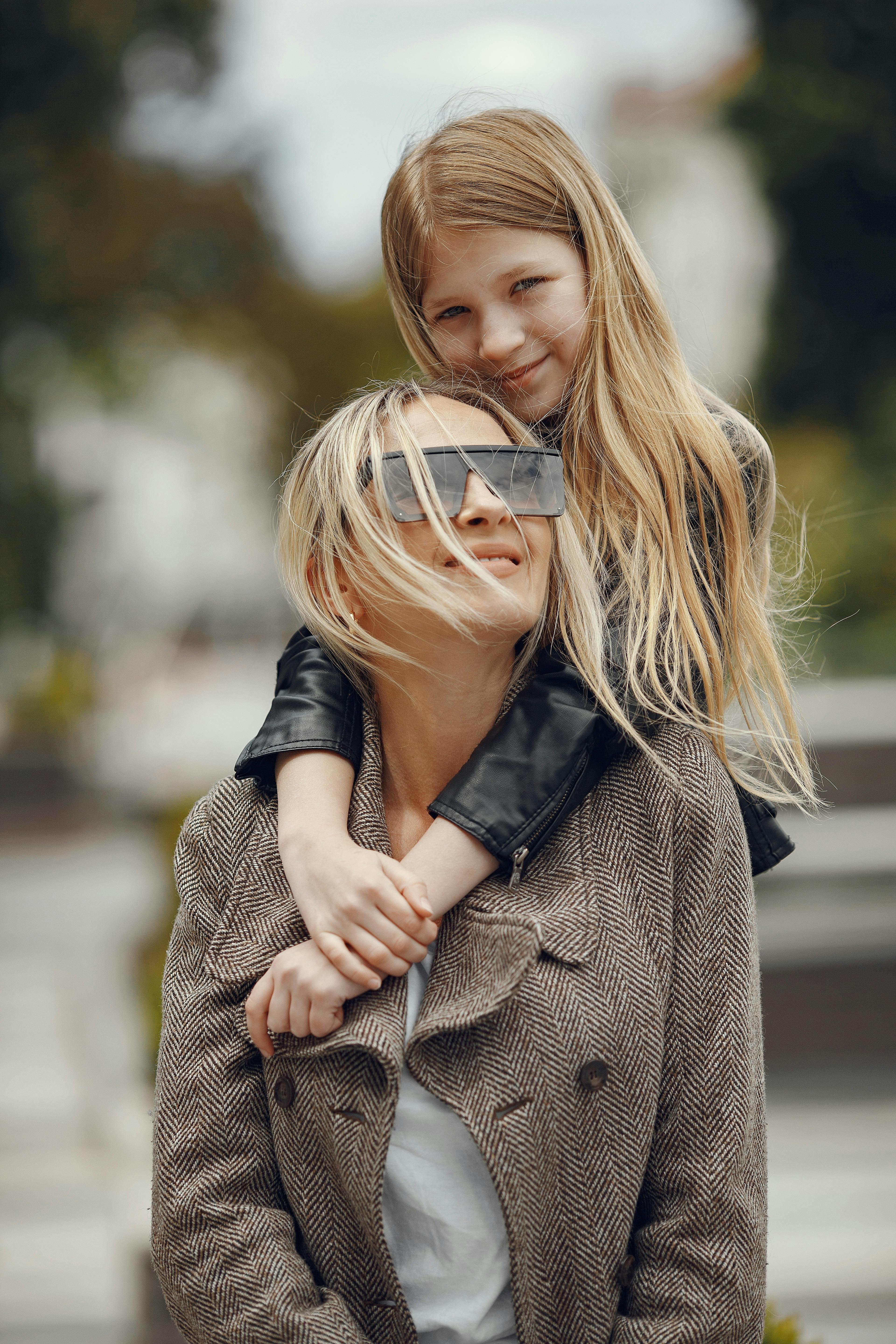 Daughter hugging mother from behind