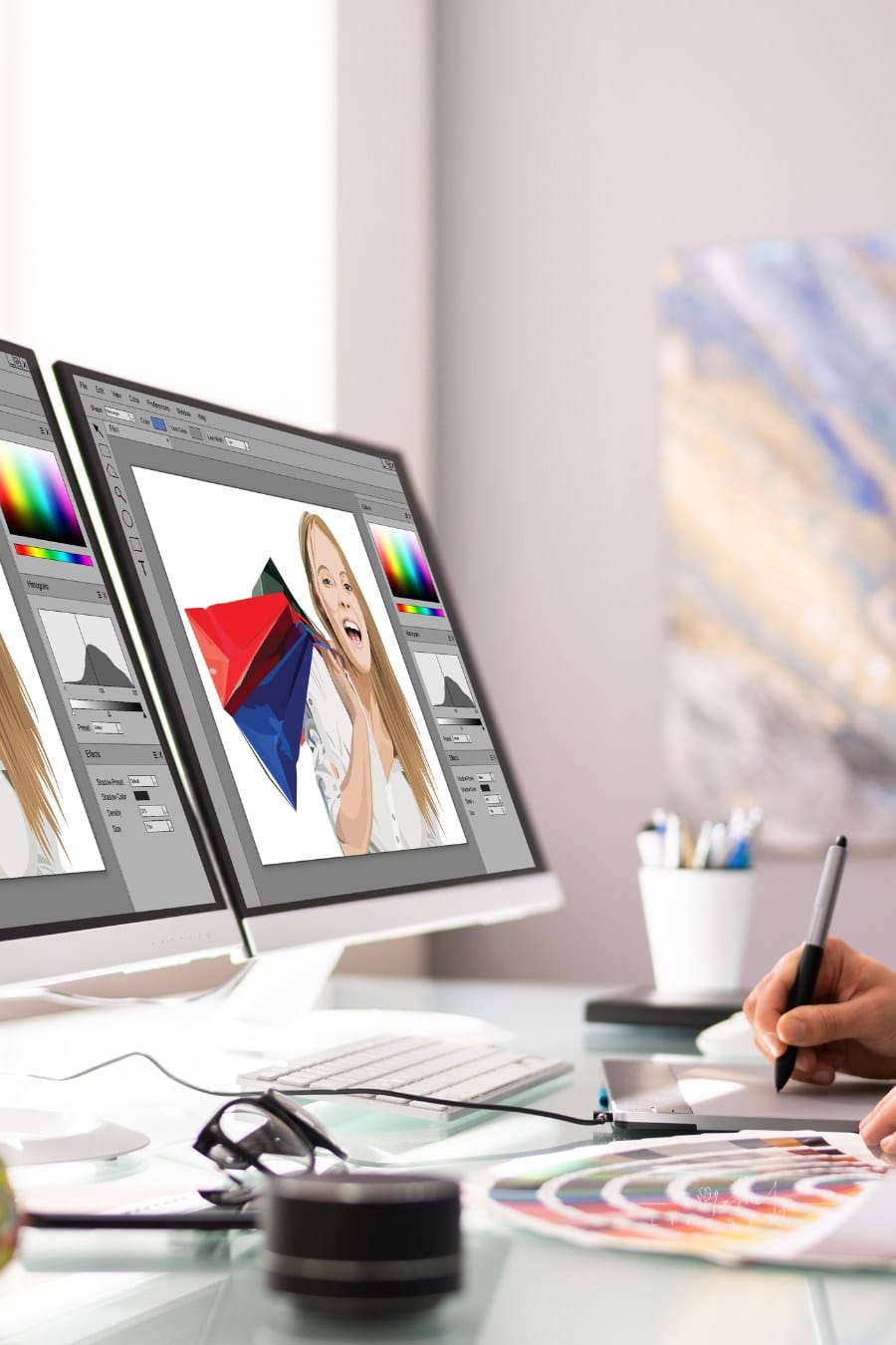 Graphic Designer Artist Working on multiple computer monitors