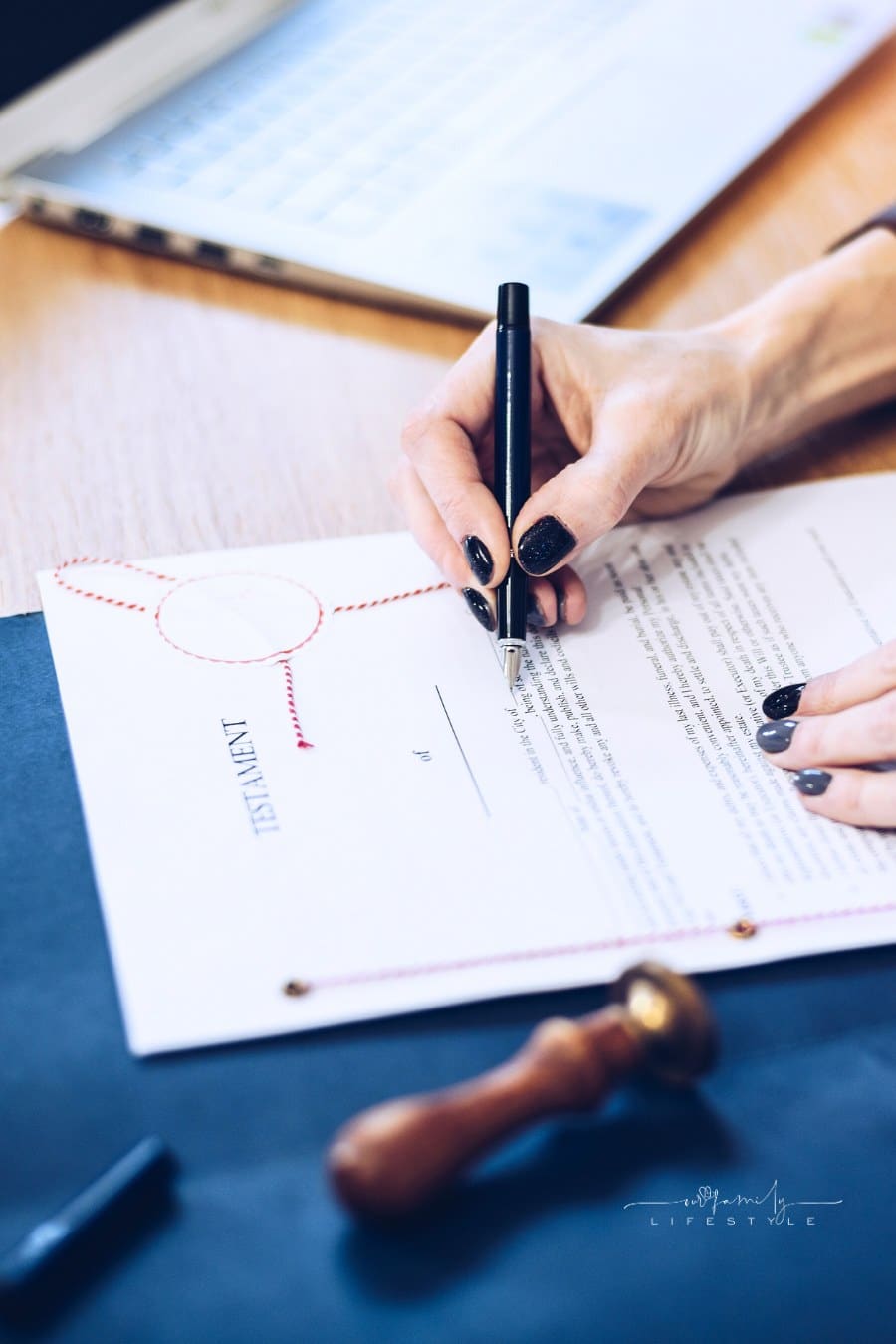 Woman notary signing last will and testament, closeup.