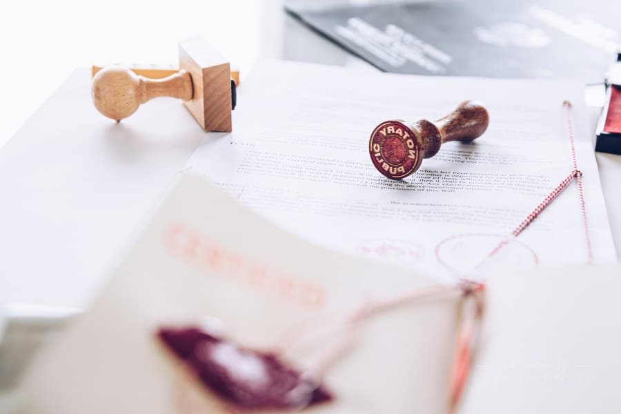 Notary seals on a notary's desk. Last Will Document.
