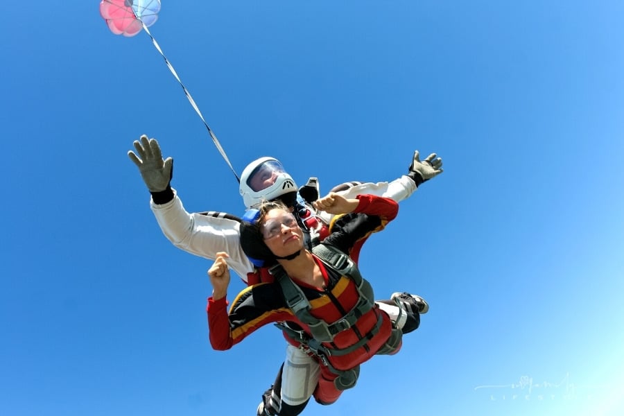 woman tandem skydive jump