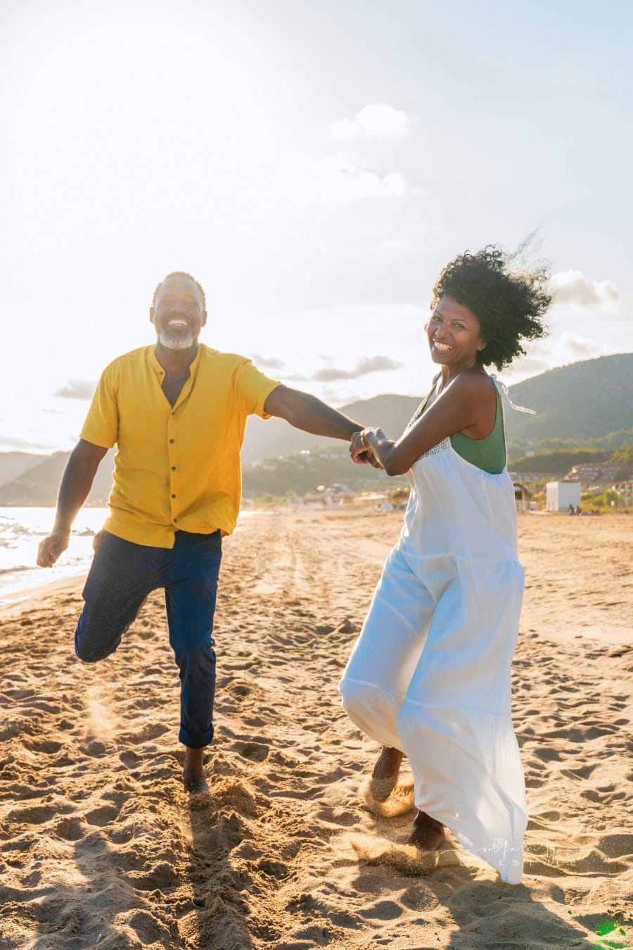 Beautiful mature black couple of lovers dating at the seaside