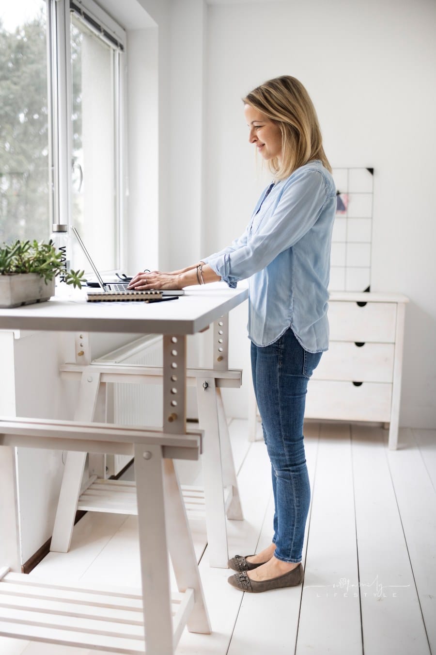 Woman Working at Ergonomic Standing Desk