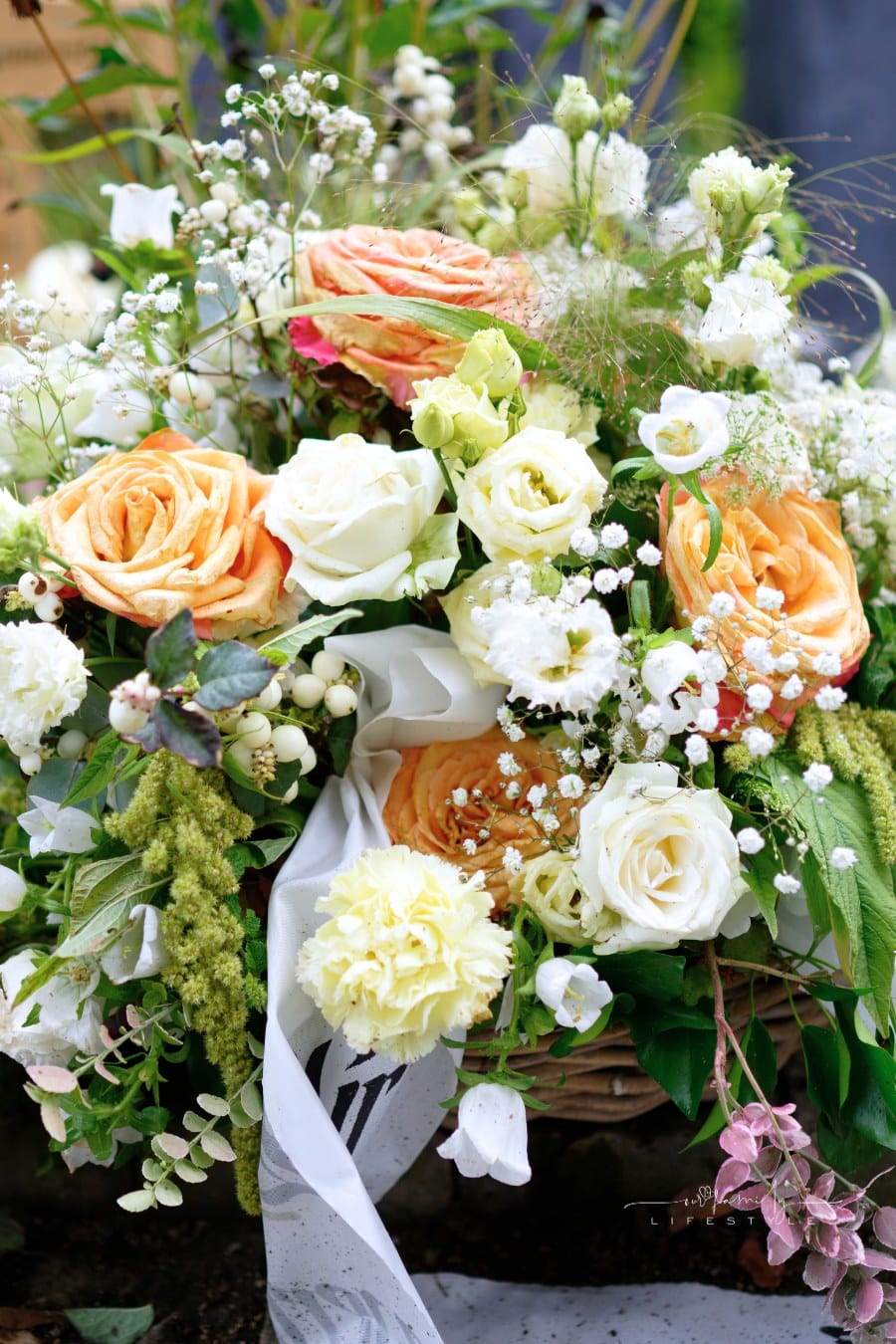 pastel funeral flowers on a grave