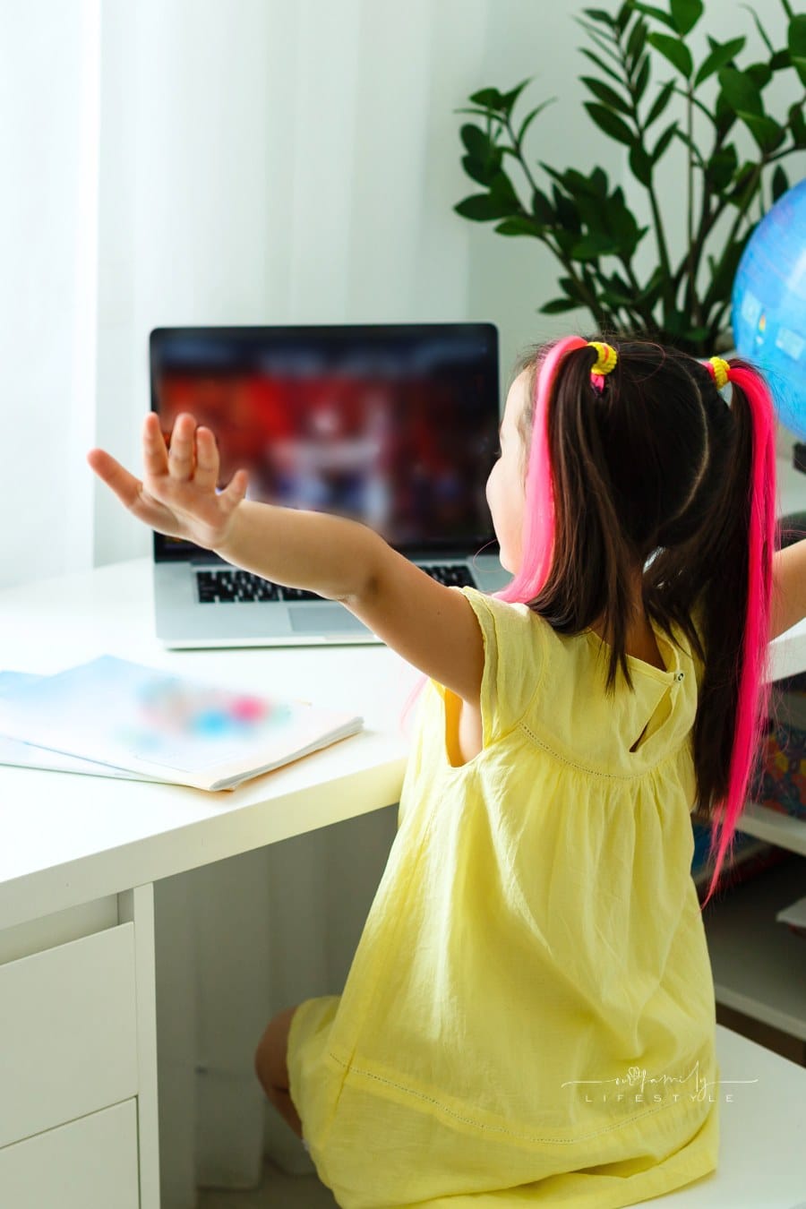 Cool Online School. Kid Studying Online at Home Using a Laptop.