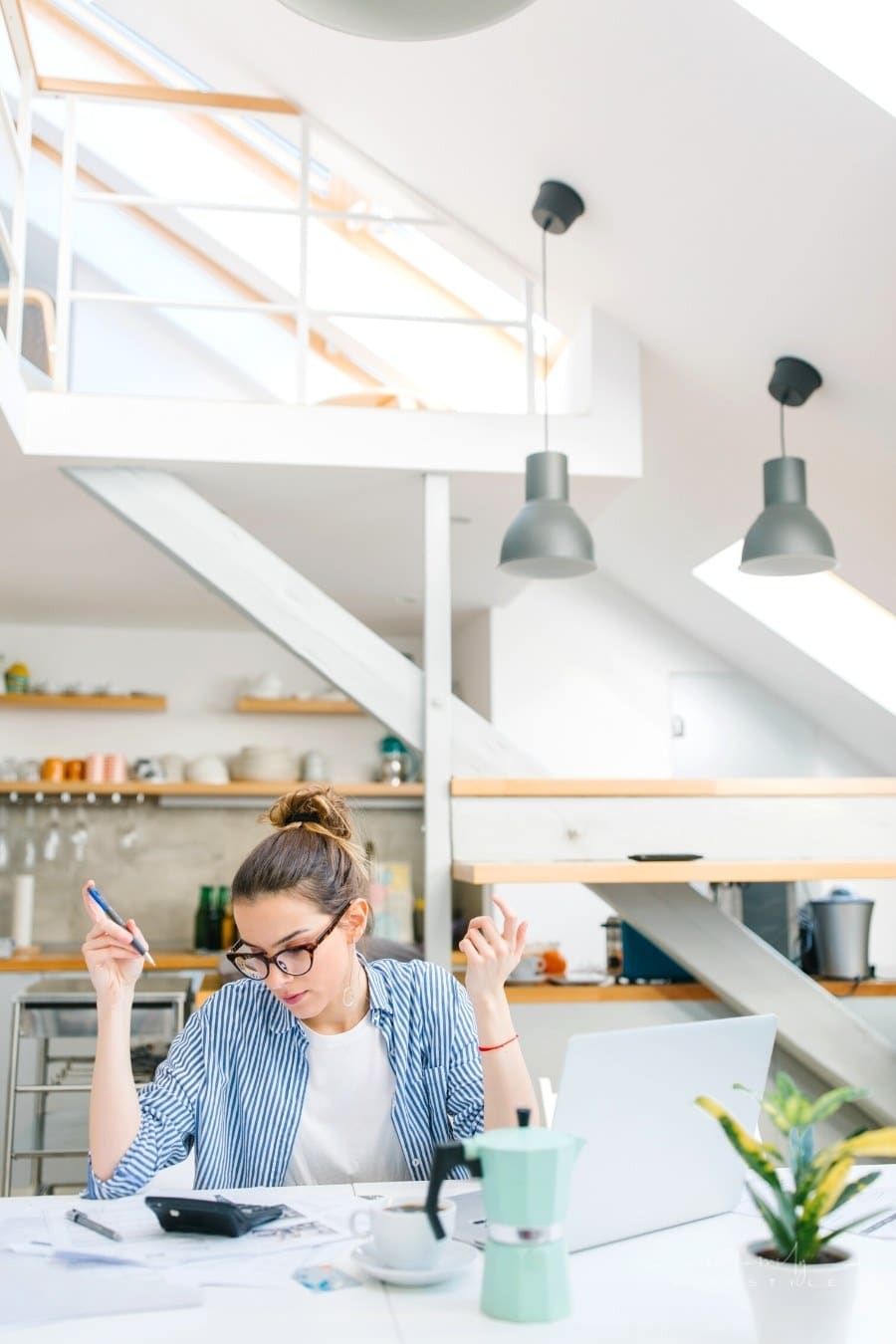 women doing budget paper work at home