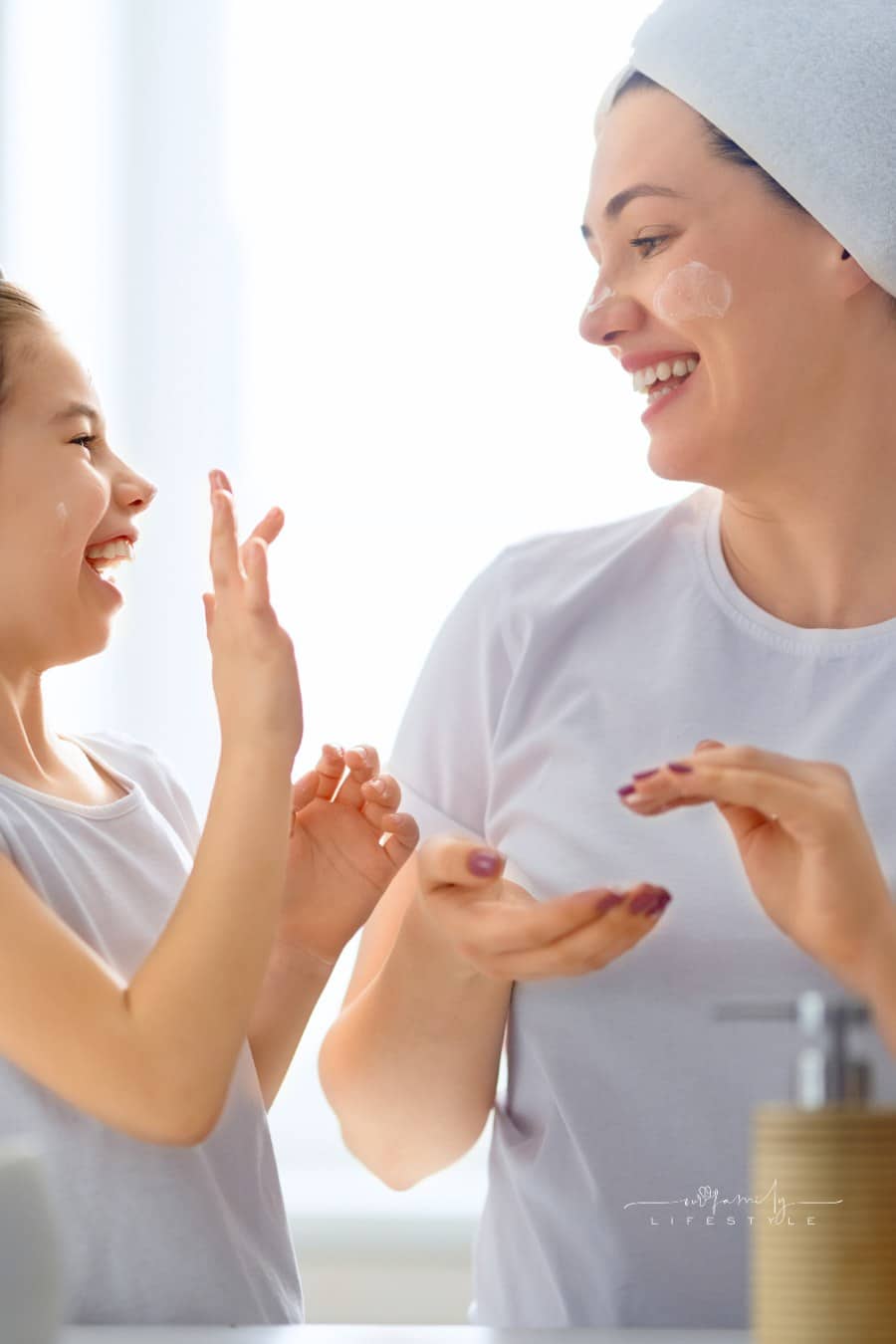 Mother and Daughter Caring for Skin