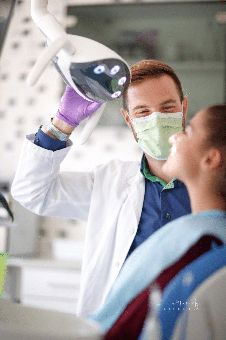 smiling dentist and patient