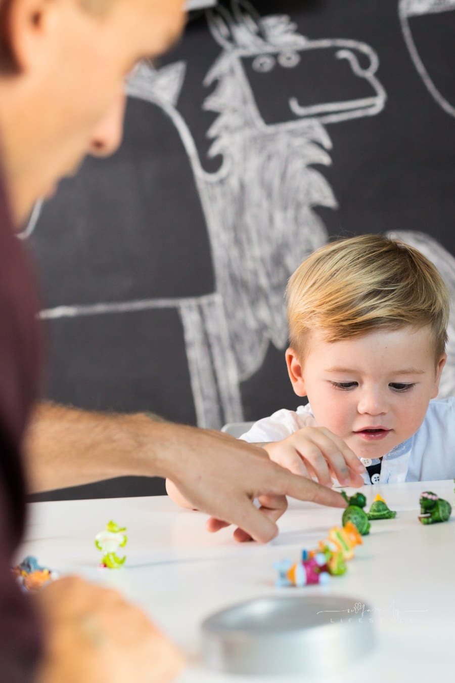 Cute little playfull toddler boy at child therapy session. Private one on one homeschooling with didactic aids.