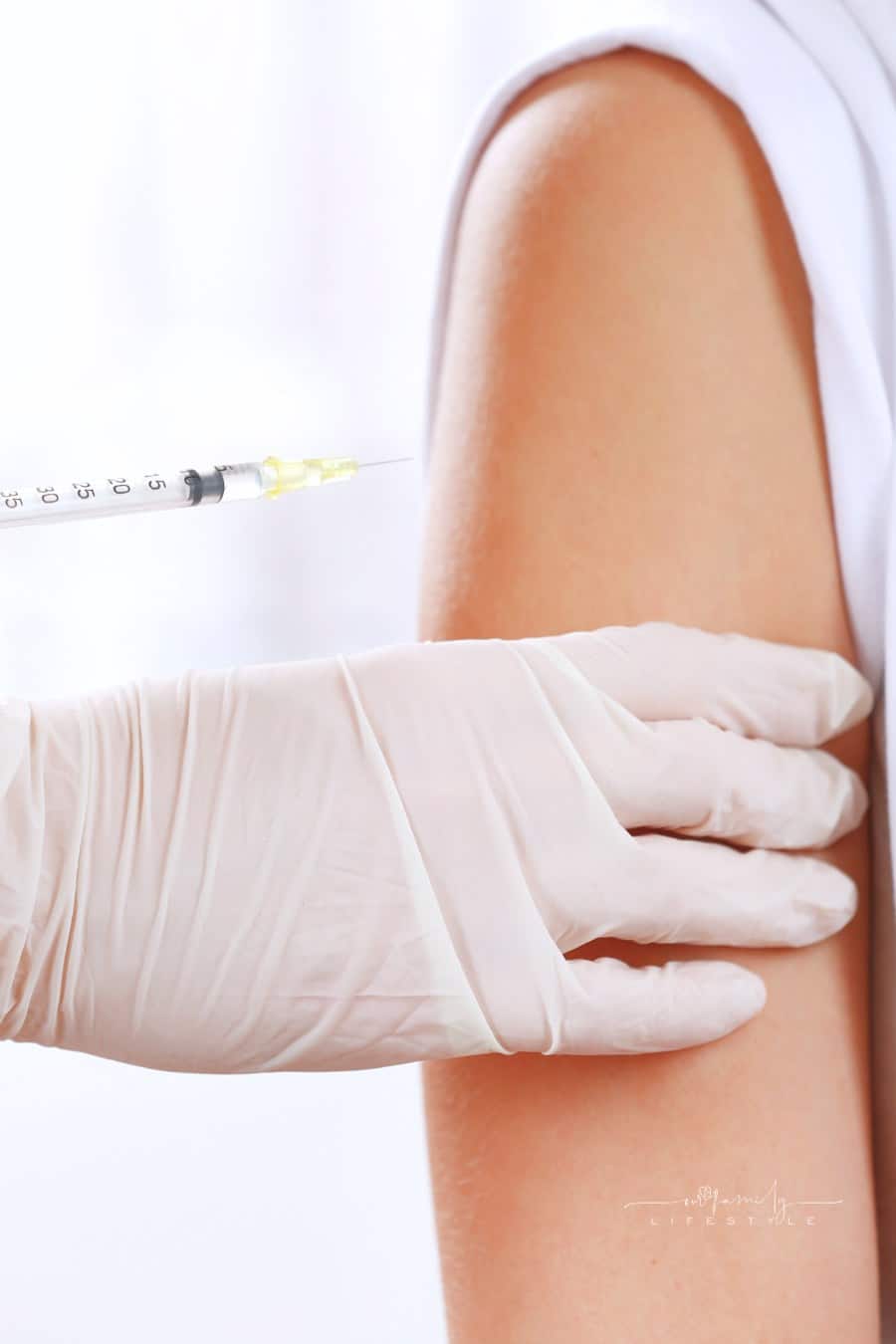 Medical Worker Injecting a Woman's Arm Up Close