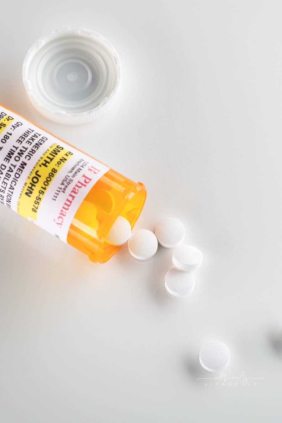 Non-Proprietary Medicine Prescription Bottle and Spilled Pills