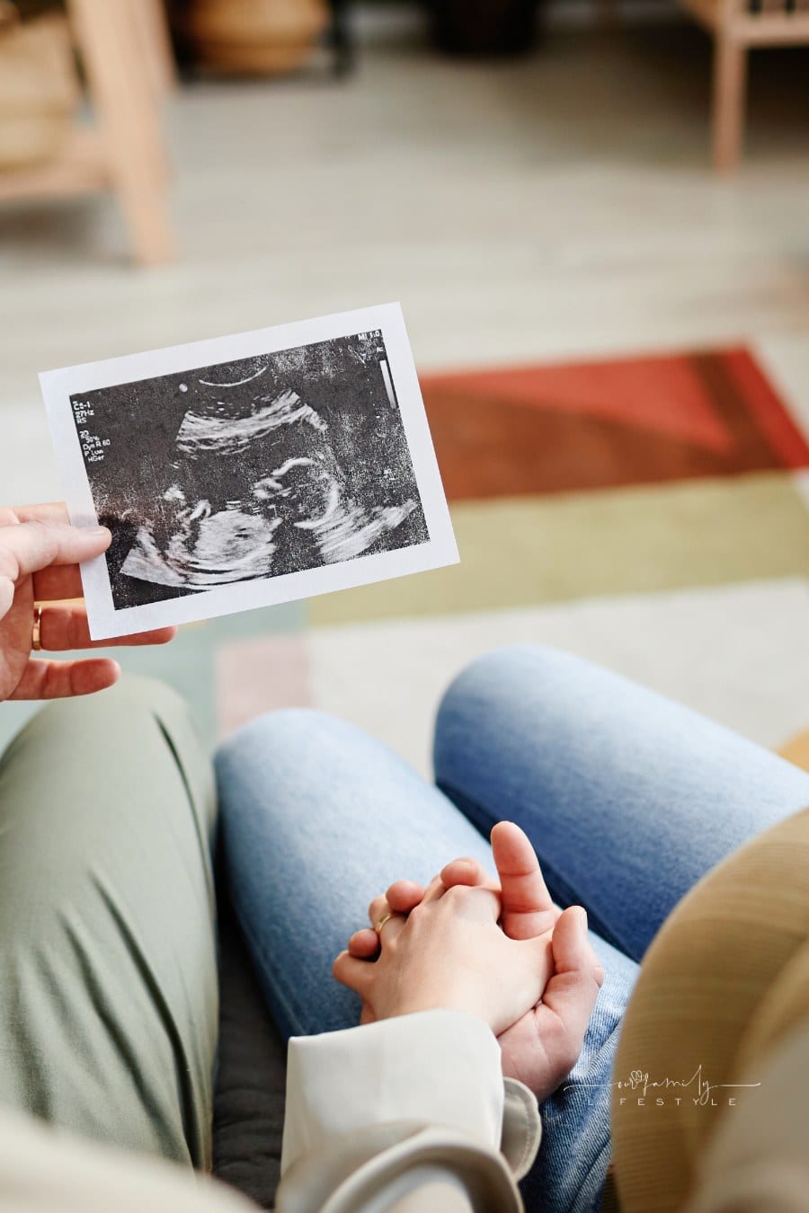 Couple Looking at Ultrasound Picture of Their Baby