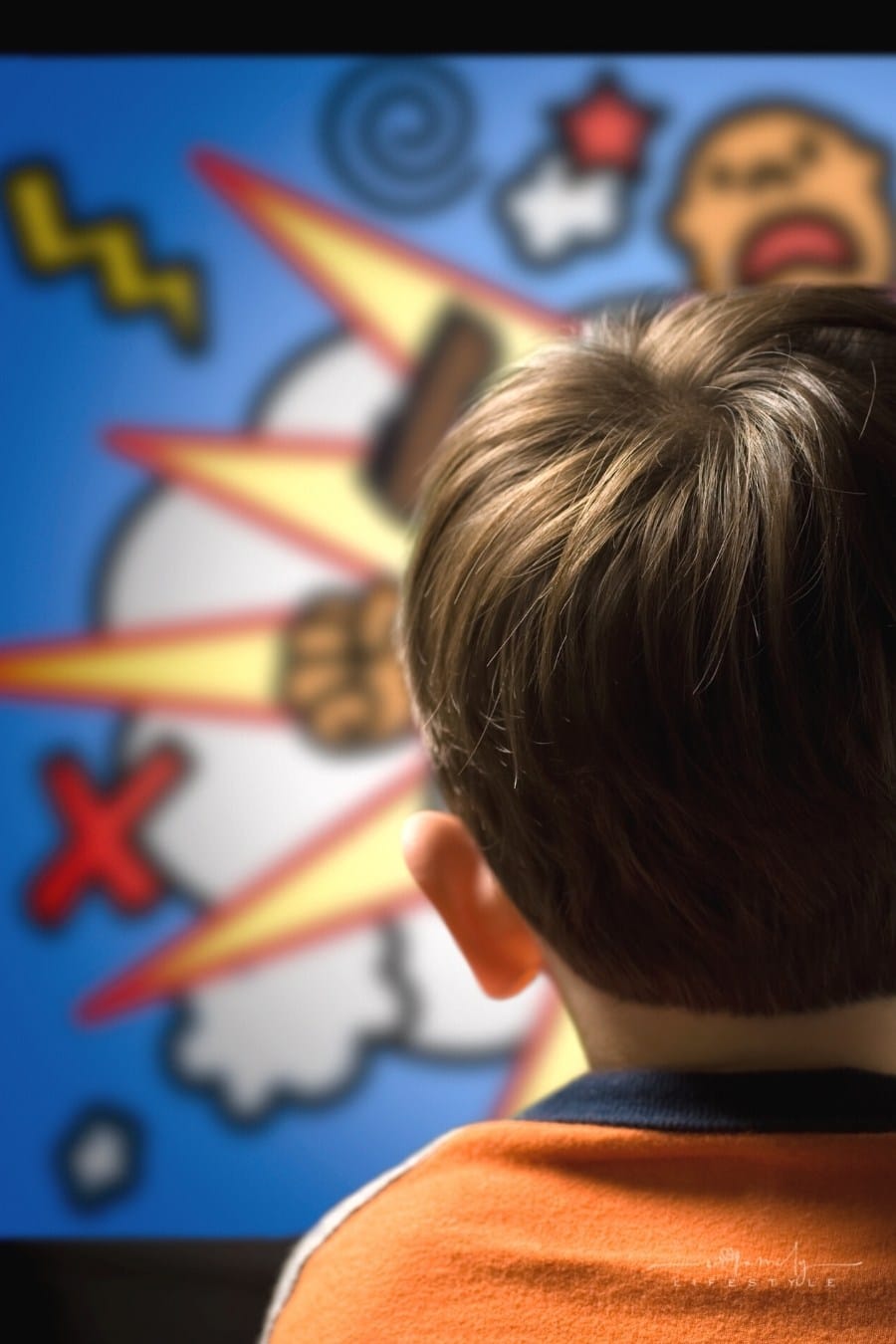 child's head from behind watching cartoons