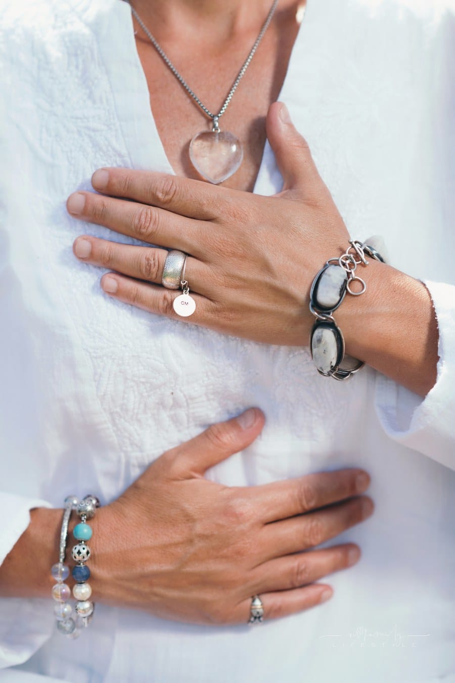 woman holding hands on chest wuth giving and receiving hand gesture