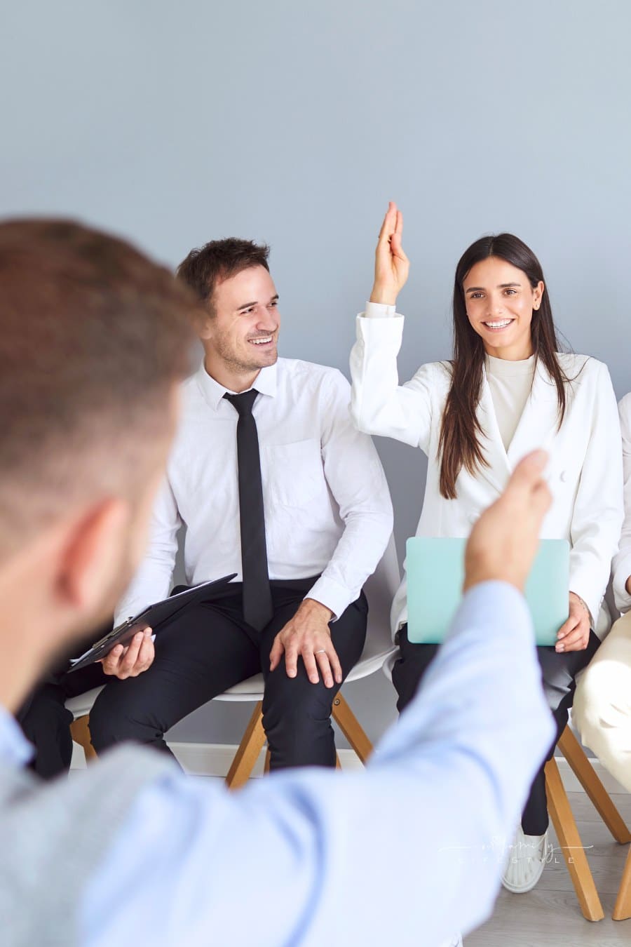 Diverse business team applicants, businesspeople sitting in row, queue waiting for job interview