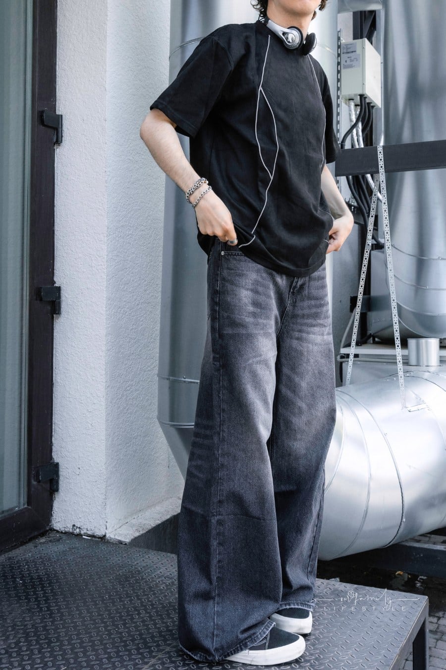 Man Posing on a Silver Industrial Background