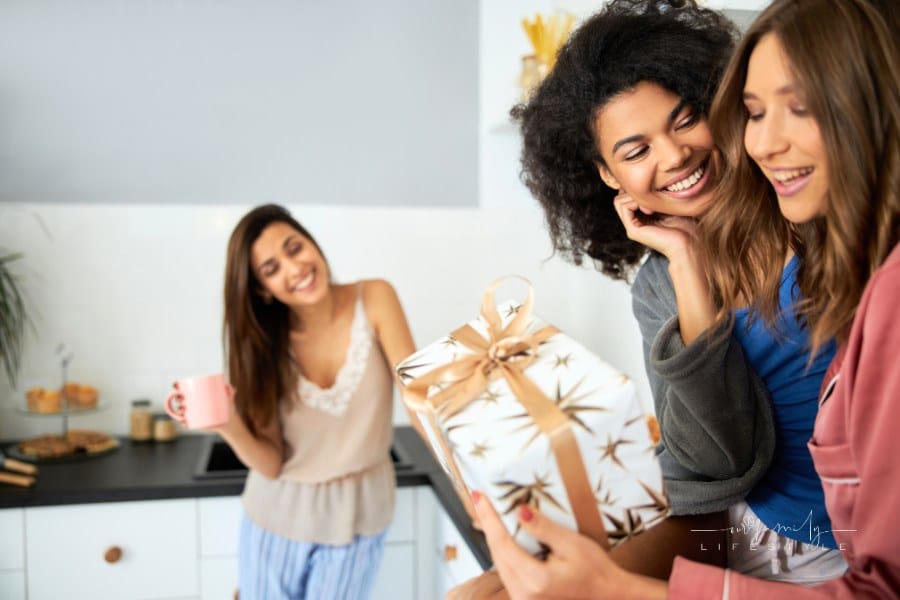 Girl giving wedding gift to her best friend