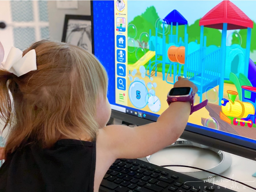 toddler playing popping bubble game on ABCmouse