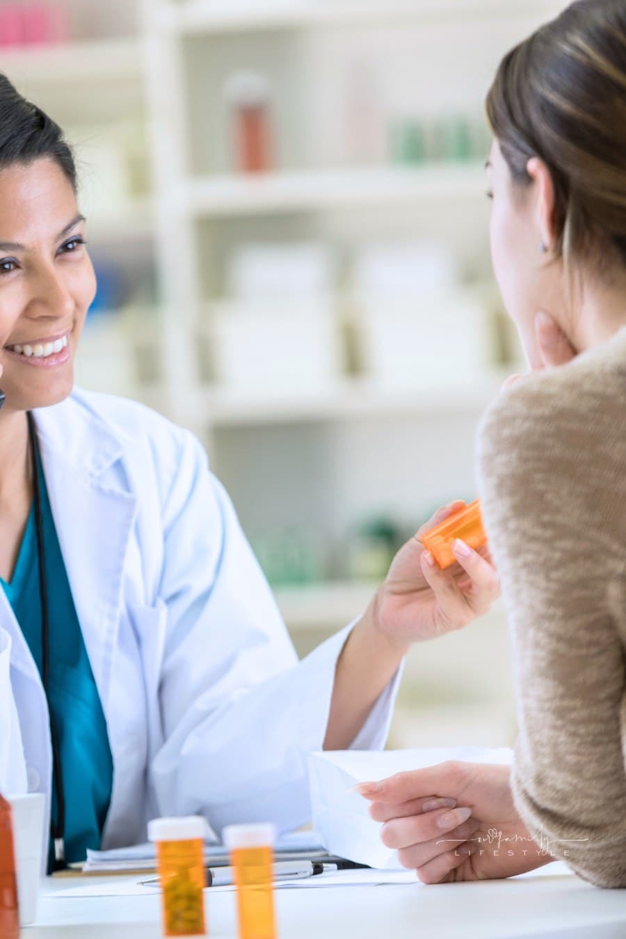 Pharmacist talks on phone with customer's insurance company