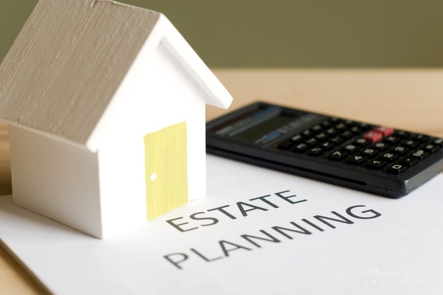 estate planning documents on table with calculator