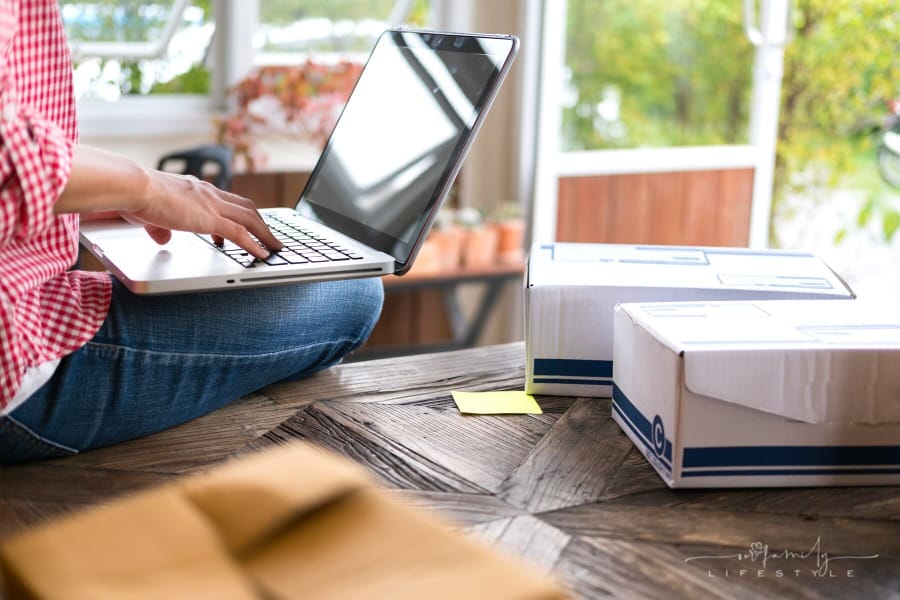 woman preparing online orders for shipping