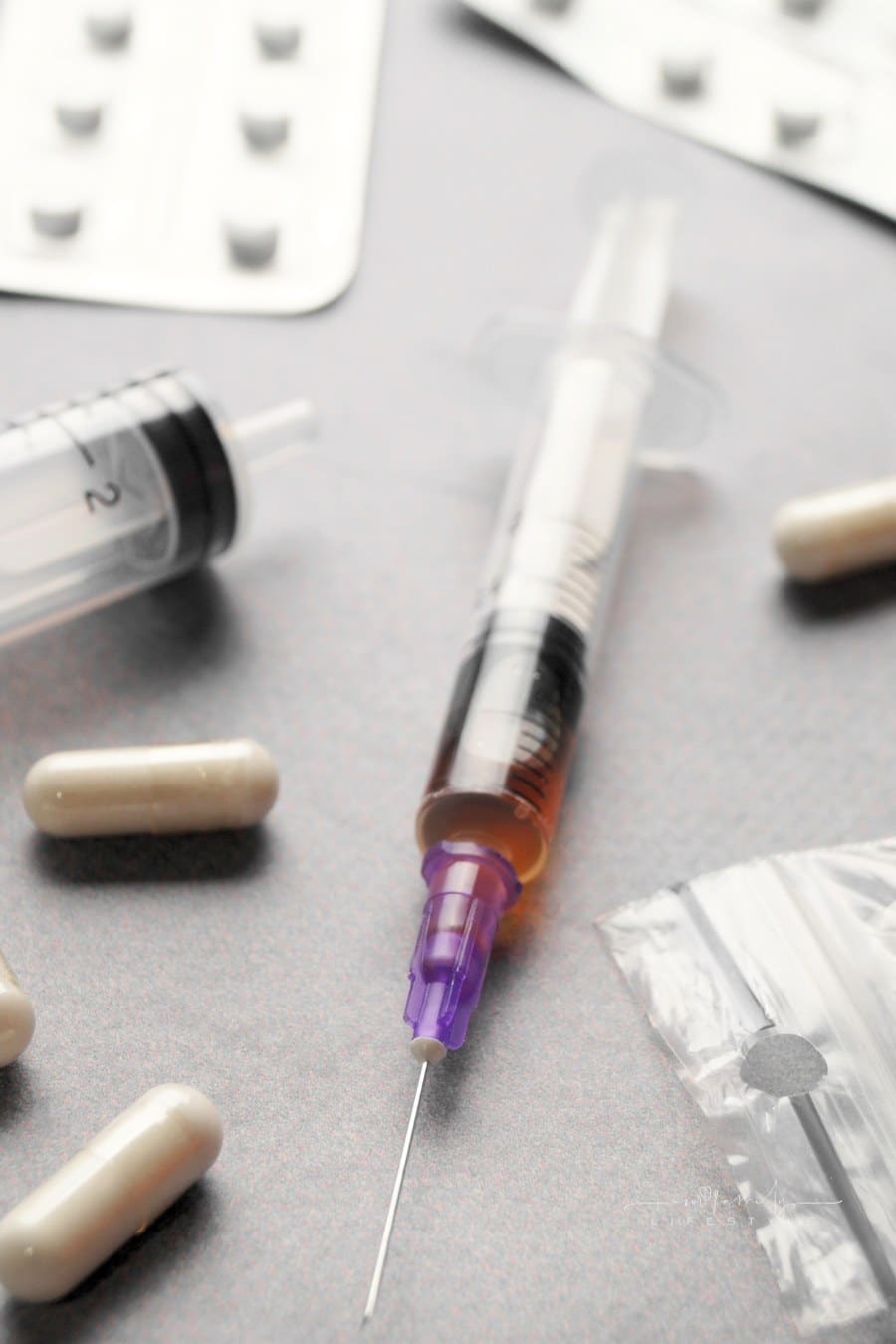 Different Hard Drugs on Light Grey Table