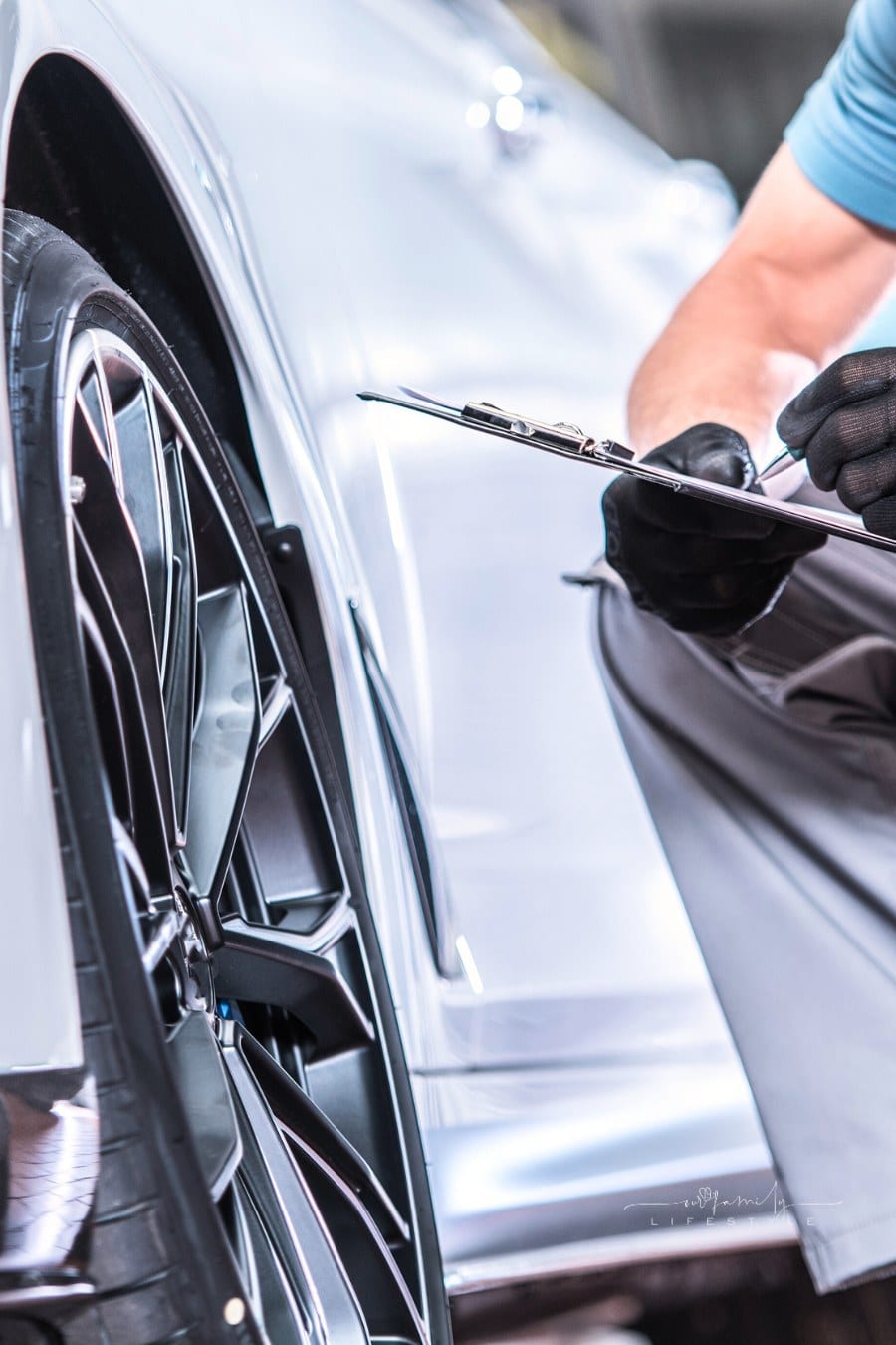 mechanic doing vehicle inspection on used car