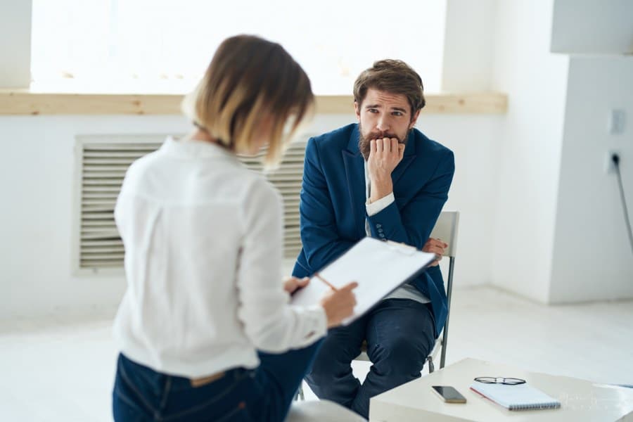 man visiting his therapist