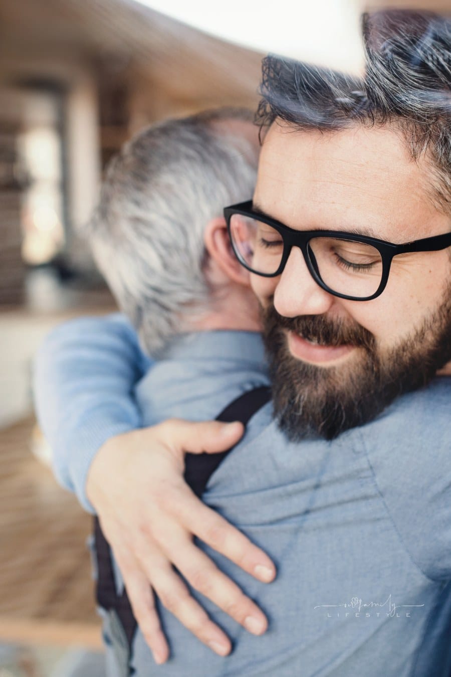 Son and elderly Father Hugging