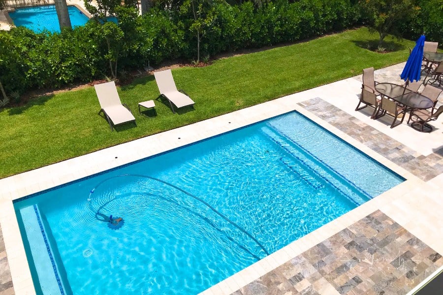 Swimming pool in the backyard of house