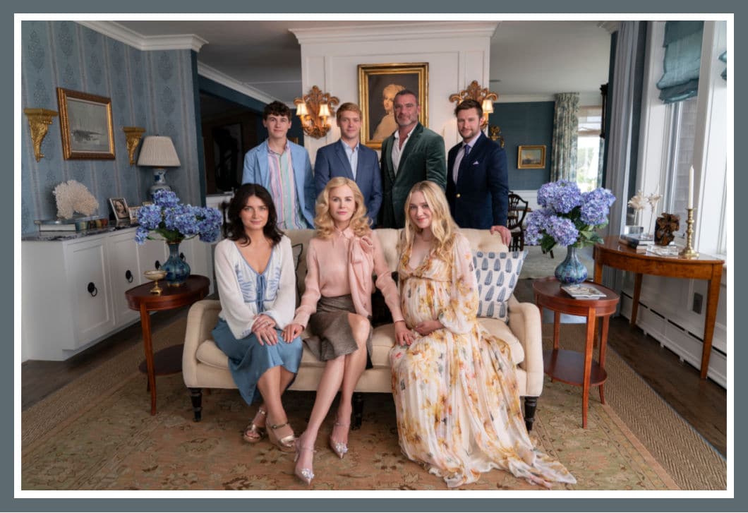 Cast of Netflix's series The Perfect Couple, featuring an ensemble of elegantly dressed characters in a sophisticated living