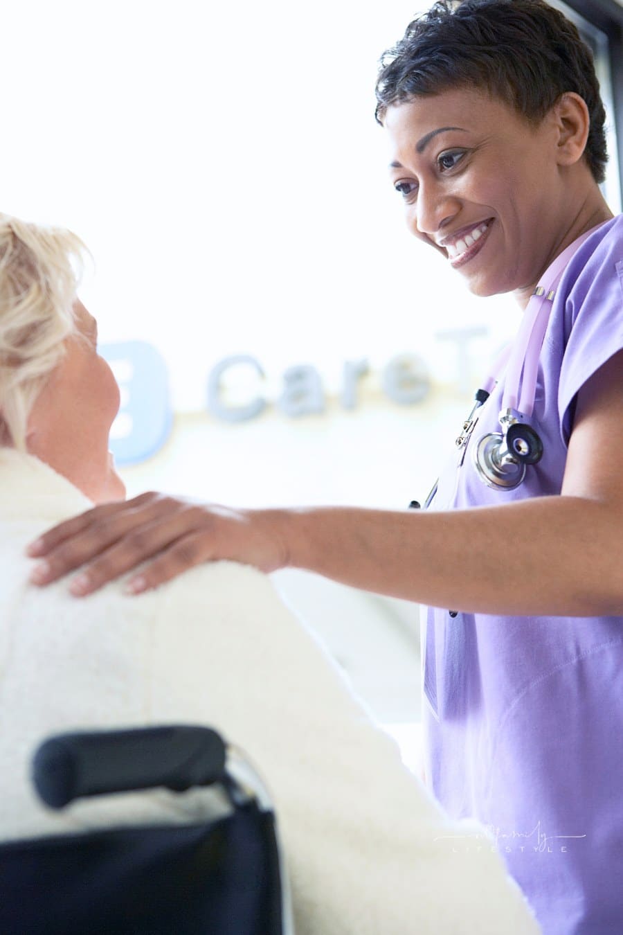 Happy Nurse With Hand Elderly Patient's Shoulder