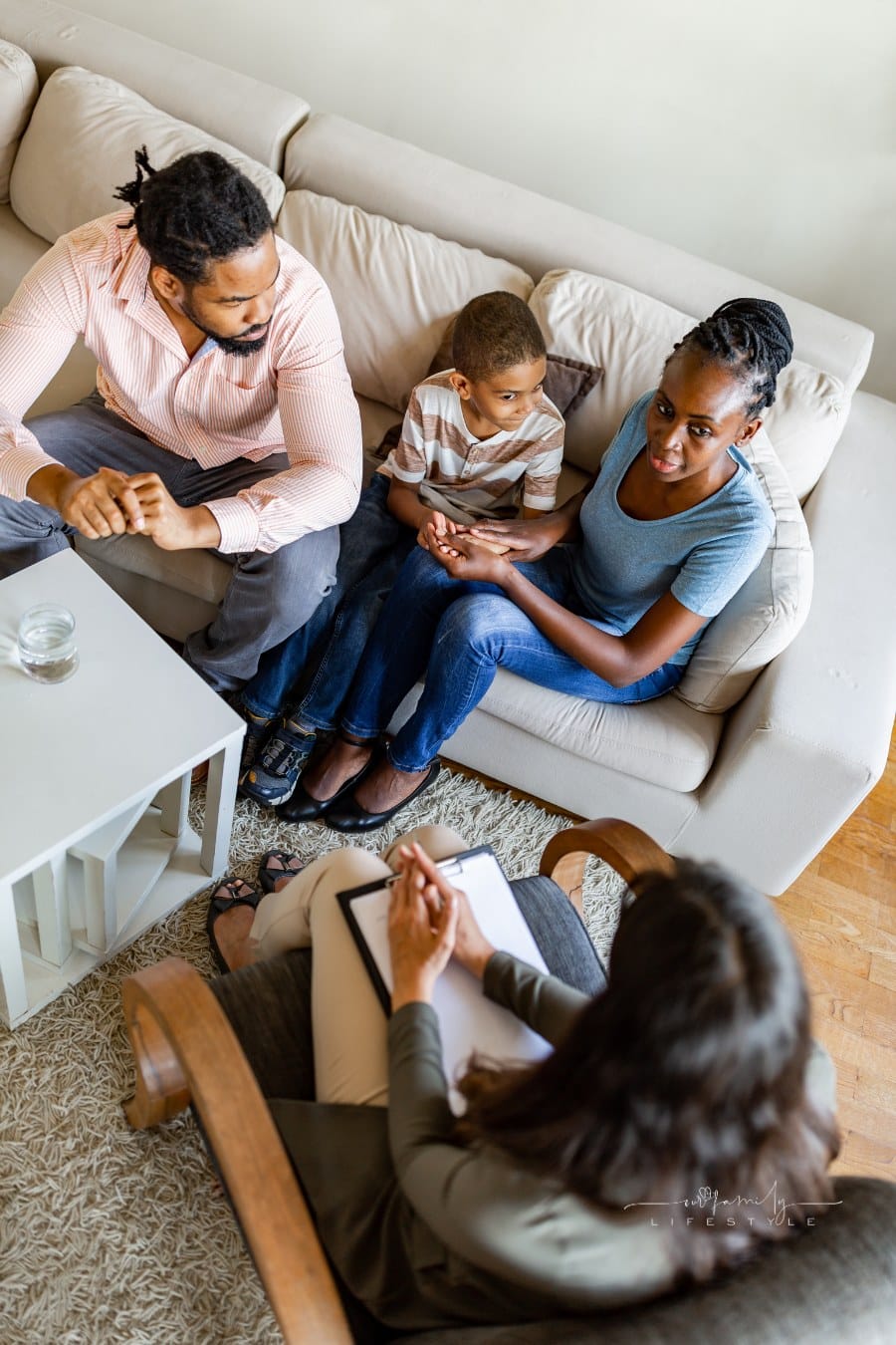 Family in a parenting coach therapy session