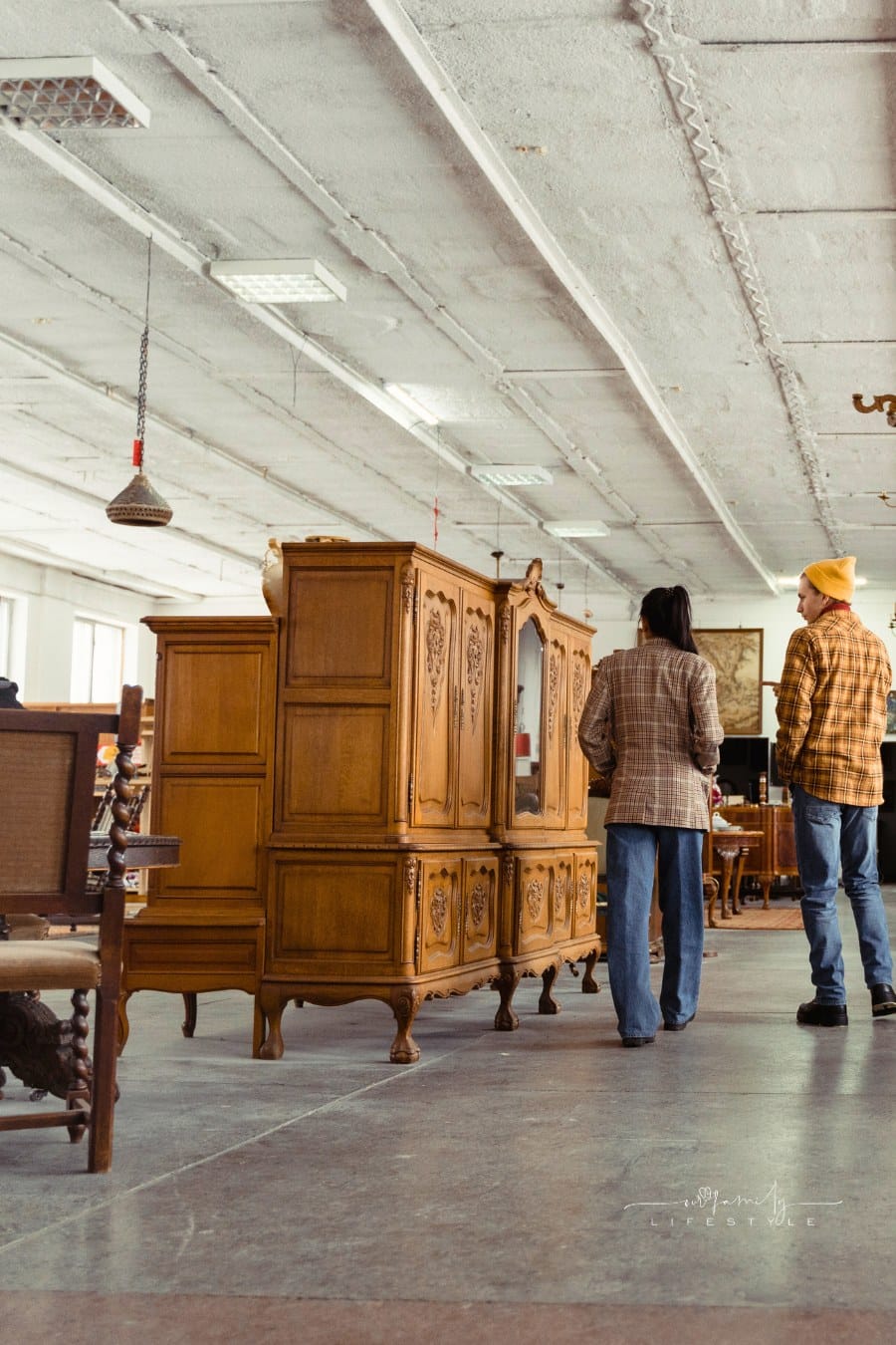 Customers Taking a Look at a Vintage Furniture Shop