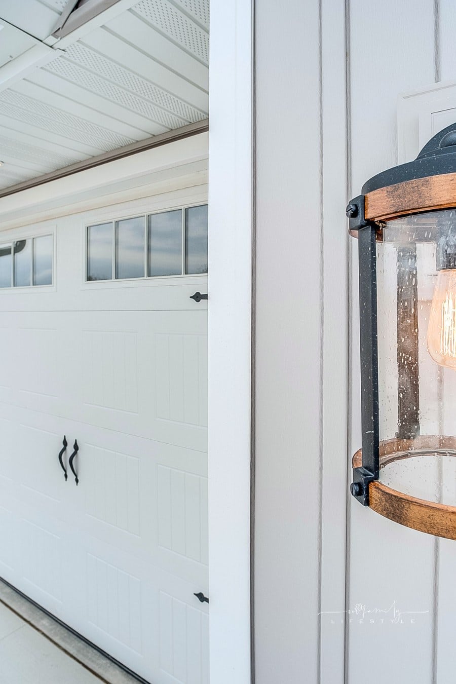 Close up of sconce on the house next to the garage