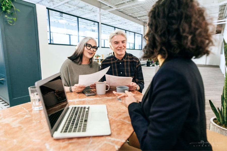senior couple meeting with financial advisor for estate planning